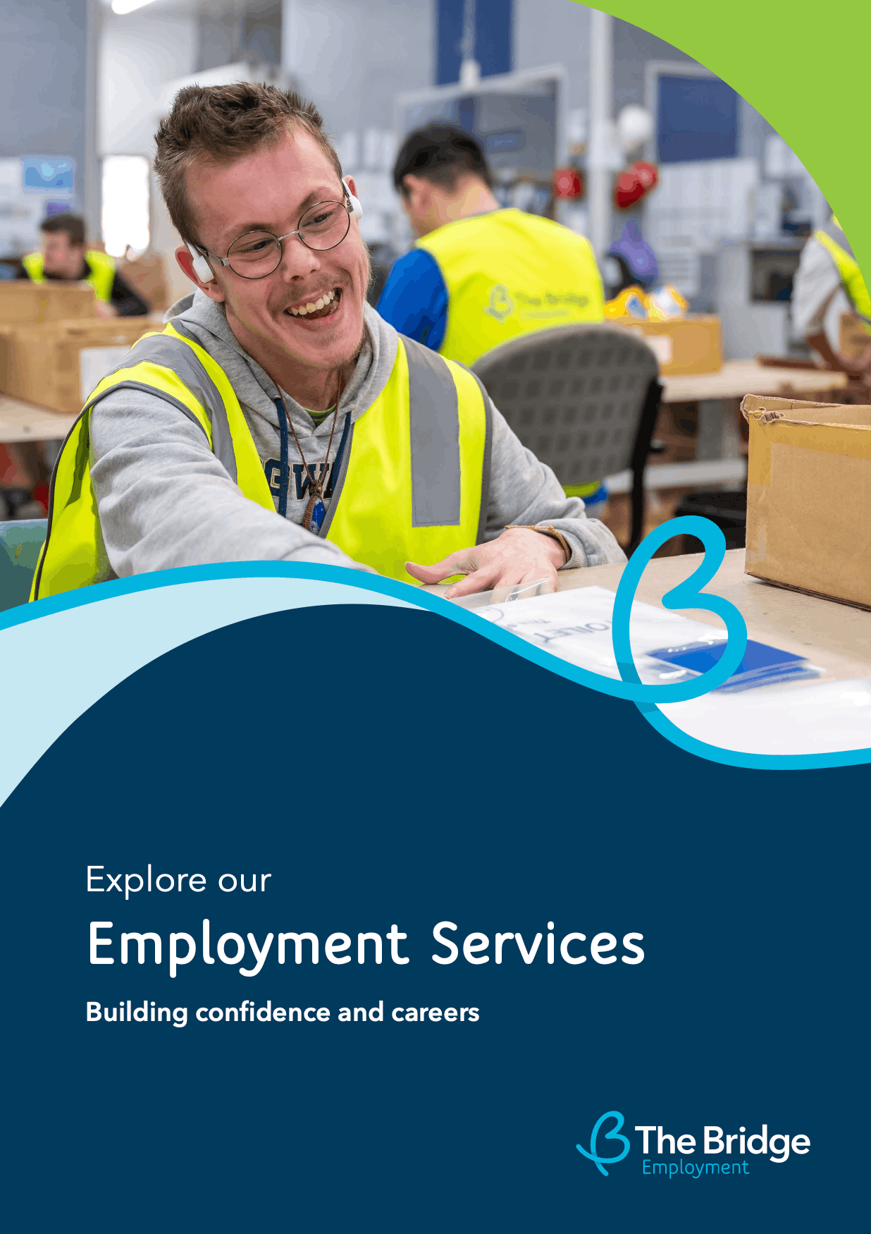 Man in a hi-vis vest smiles while working at a table in a warehouse; text reads Employment Services, The Bridge Employment.